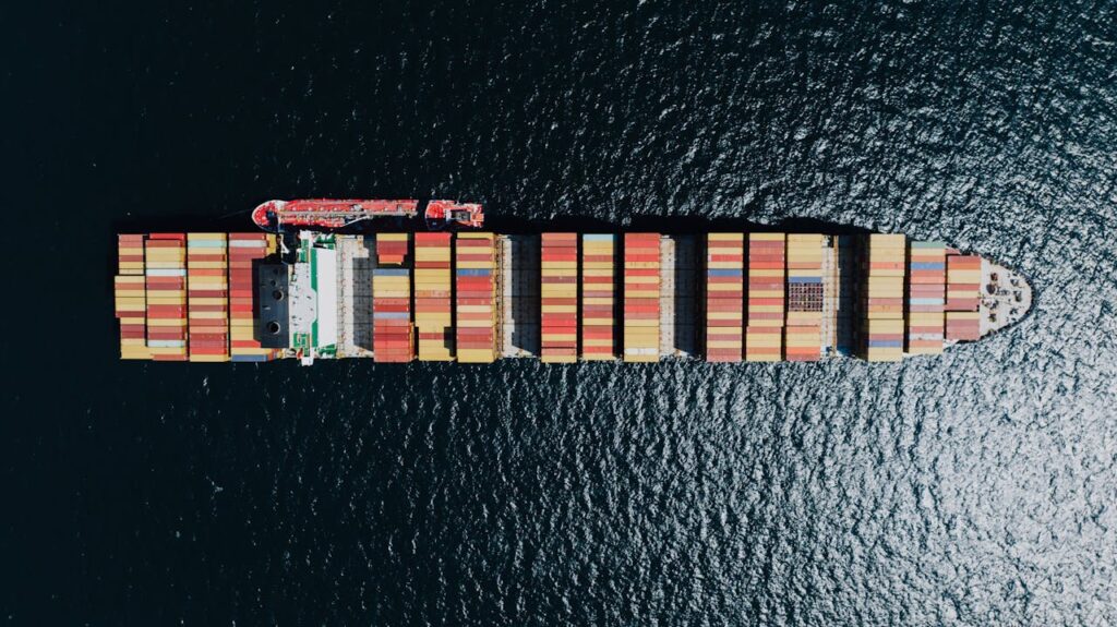pexels-photo-12530458 Aerial view of a large container ship sailing near Naples, Italy.